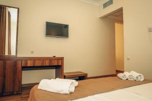 Postel nebo postele na pokoji v ubytování Hotel Kolkhi Shekvetili