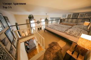 a view of a bedroom with a bed and a staircase at City Apartment Vienna in Vienna