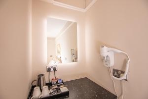 a hair salon with a hair dryer in a room at Redhouse in Salisbury