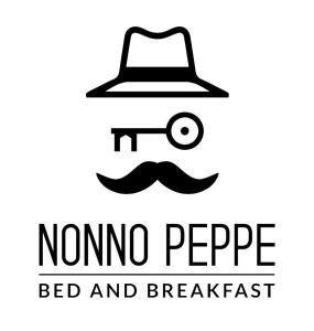 un cartel con sombrero y bigote y la cama de los niños. en B&B NONNO PEPPE, en Perano