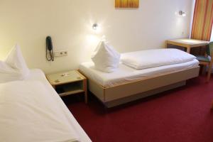 Tempat tidur dalam kamar di Hotel Scholz
