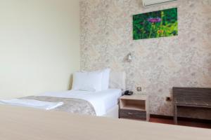 Postel nebo postele na pokoji v ubytování Hotel Livade