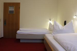 Postel nebo postele na pokoji v ubytování Hotel Scholz