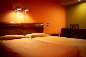 Postel nebo postele na pokoji v ubytování Hotel Due Platani
