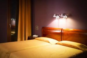Postel nebo postele na pokoji v ubytování Hotel Due Platani