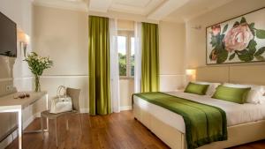 
a bedroom with a large bed and a large window at Hotel Cristoforo Colombo in Rome
