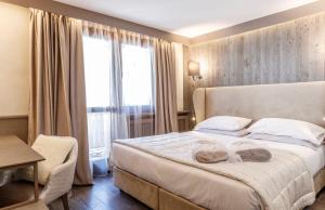 Voodi või voodid majutusasutuse Hotel Spinale toas