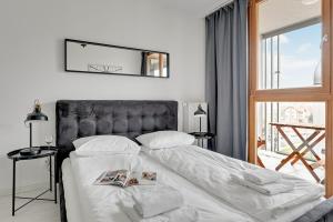 Postel nebo postele na pokoji v ubytování GRANO FLATS Gdańsk - Aura I + 31 fotografií
