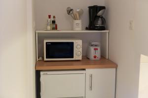 Kuchyň nebo kuchyňský kout v ubytování Apartments Rose