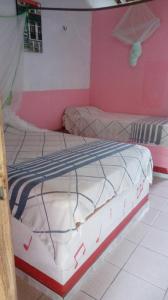 Кровать или кровати в номере Pousada Ventania Do Rio-Mar