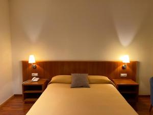 Postel nebo postele na pokoji v ubytování Hotel Berga Park