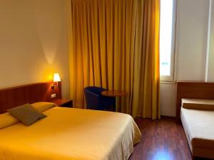 Postel nebo postele na pokoji v ubytování Hotel Berga Park