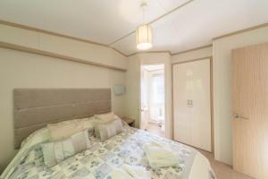 Ένα ή περισσότερα κρεβάτια σε δωμάτιο στο Willow Lodge