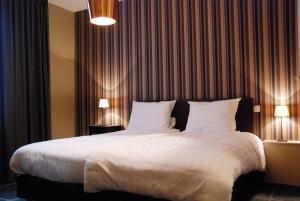 Ένα ή περισσότερα κρεβάτια σε δωμάτιο στο Jachthuis Au Bois Du Gheer