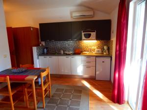 Kuchyň nebo kuchyňský kout v ubytování Adrienn Apartments