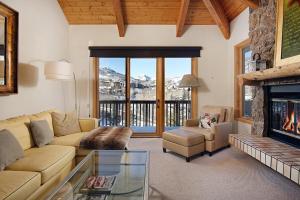 a living room with a couch and a fireplace at 229 Faraway The Ridge #36 condo in Snowmass Village
