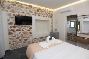 Llit o llits en una habitació de Acrothea Perdika