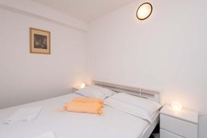Posteľ alebo postele v izbe v ubytovaní Apartments Jane Perna