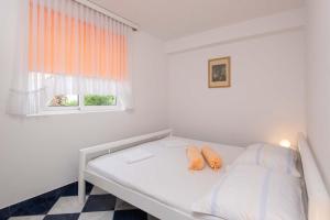 Posteľ alebo postele v izbe v ubytovaní Apartments Jane Perna