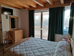 A bed or beds in a room at Az. Agr. Sponga Giancarlo