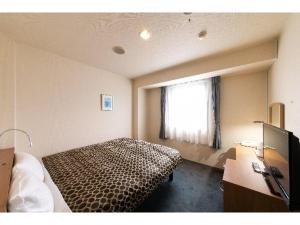 Giường trong phòng chung tại Hotel Ermou Regency
