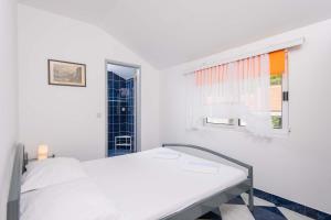 Posteľ alebo postele v izbe v ubytovaní Apartments Jane Perna
