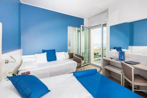 Cama o camas de una habitación en Majestic Beach Hotel & Wellness