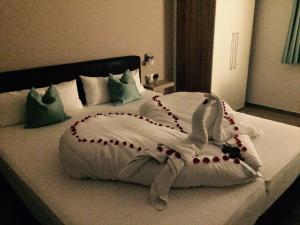 Ένα ή περισσότερα κρεβάτια σε δωμάτιο στο Hotel Claro Garni