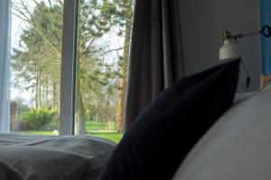 Postel nebo postele na pokoji v ubytování Lot Lodge Travemünde
