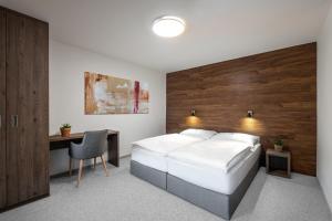 En eller flere senge i et værelse på KEILBERG RESORT