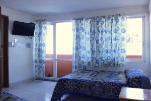 Postel nebo postele na pokoji v ubytování Hotel Plaza Aleman