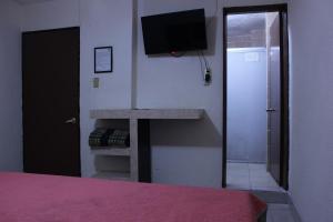 Postel nebo postele na pokoji v ubytování Hotel Plaza Aleman