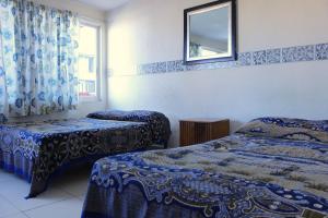 Postel nebo postele na pokoji v ubytování Hotel Plaza Aleman