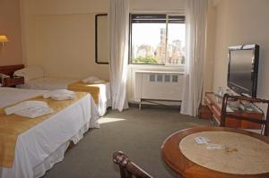 Säng eller sängar i ett rum på Hotel Sussex