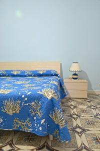 Postel nebo postele na pokoji v ubytování Corricella House
