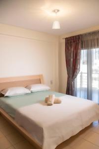 Postel nebo postele na pokoji v ubytování Villa Aggelos