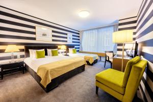 Posteľ alebo postele v izbe v ubytovaní Ambra Hotel