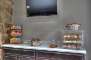 a counter top with a variety of desserts on it at River Edge Inn in Gatlinburg
