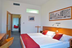 Postel nebo postele na pokoji v ubytování Avanti Hotel + 37 fotografií