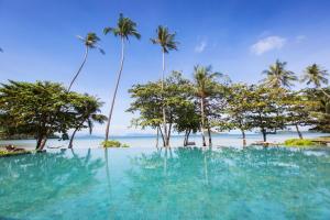 a large body of water with palm trees at Mira Montra Resort Koh Mak - SHA Plus in Ko Mak