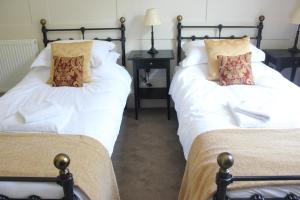 
A bed or beds in a room at Prince of Wales
