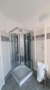 a glass shower in a bathroom with a toilet at APPARTAMENTI TICINO in Sesto Calende