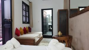 Postel nebo postele na pokoji v ubytování Riad le Voile d'Orient