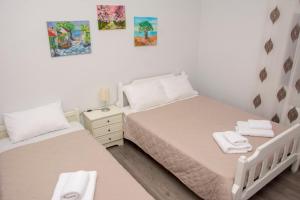 Postel nebo postele na pokoji v ubytování Stefanie's Rooms 2