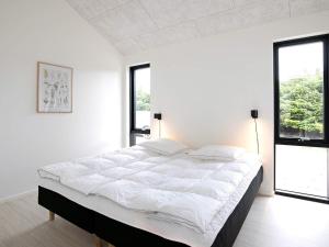 Postel nebo postele na pokoji v ubytování Holiday home Jerup XXXII