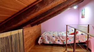 a small bedroom with a bed in a attic at Casetes Joan de Pataca 3 in Deltebre +14 photos