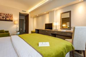 Posteľ alebo postele v izbe v ubytovaní Hotel Tami Residence