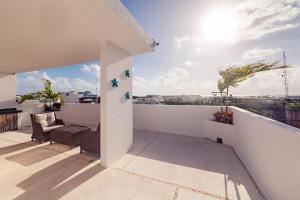 a view from the balcony of a house at Mararena Condos by Nah Hotels in Playa del Carmen