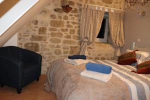 Ein Bett oder Betten in einem Zimmer der Unterkunft Villa le Prieuré du Lot, proche Sarlat