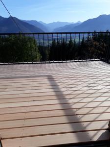a view of a deck with mountains in the background at Schlagerberg in Scharnstein